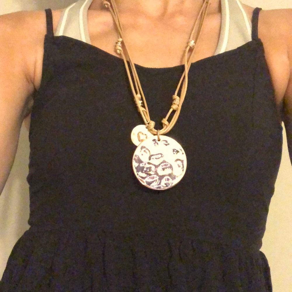 Beautiful rustic necklace with a rope tied to the top and a  Jeremiah 31:3 verse